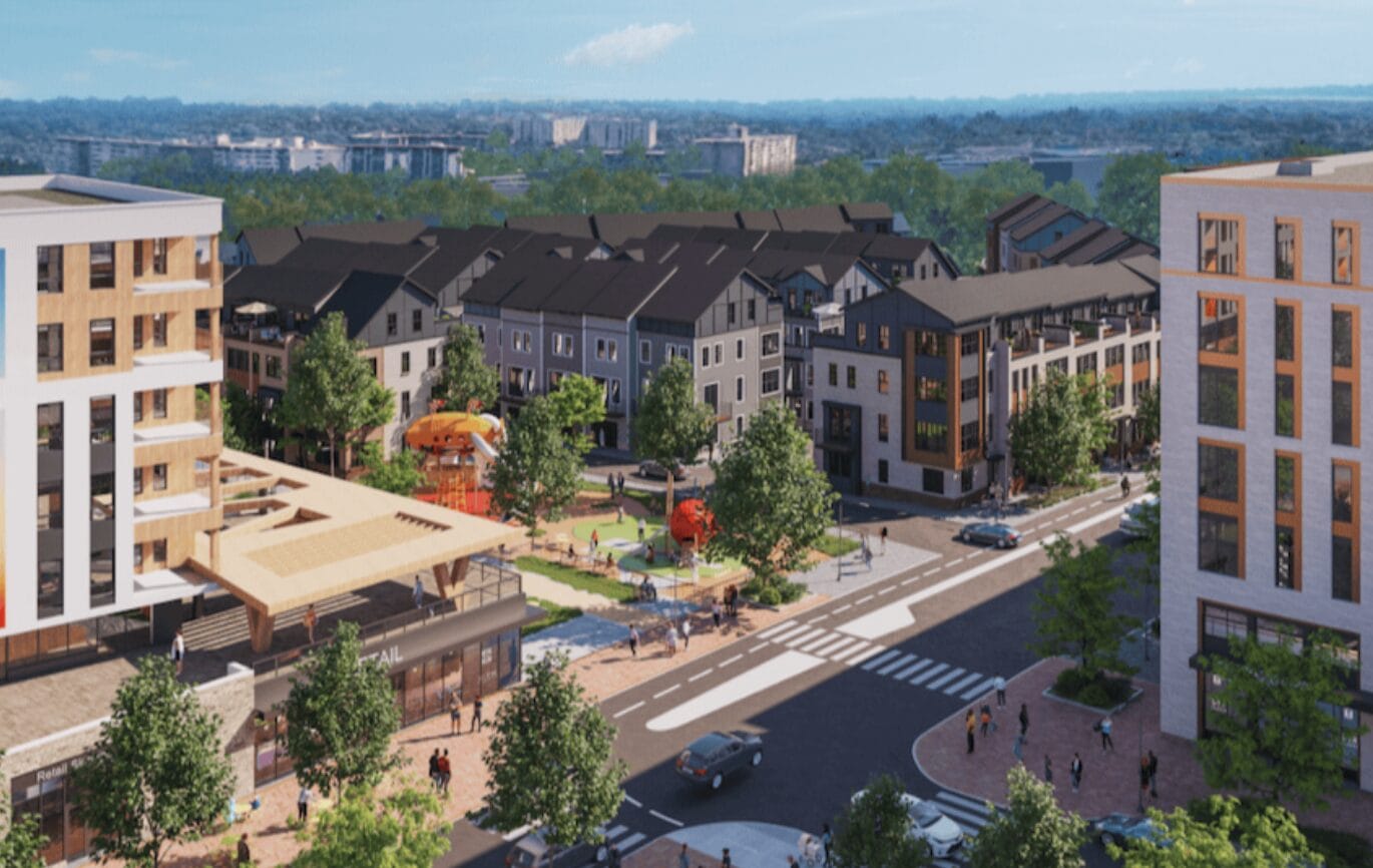 Bird’s-eye view of a modern urban courtyard with townhouses, trees, a small playground, and surrounding shops.