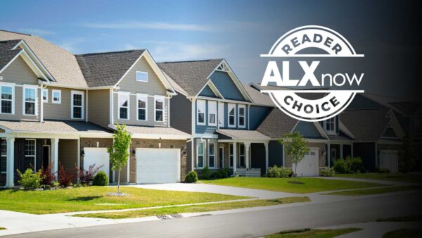 Row of modern suburban townhomes with neatly manicured lawns and a large circular 'Reader ALXnow Choice' badge on the right side.