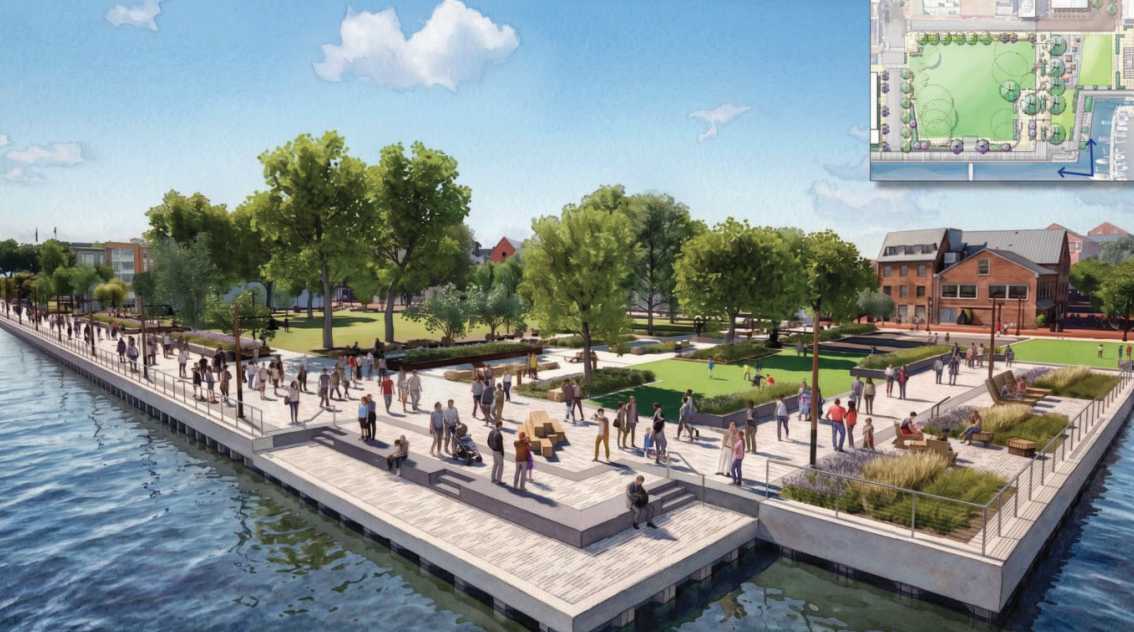A riverside park with wide stone terraces, trees, and people walking along the waterfront promenade. Inset map in the top-right corner shows the layout.